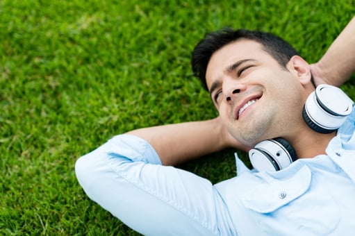 Portrait of a man relaxing outdoors with headphones