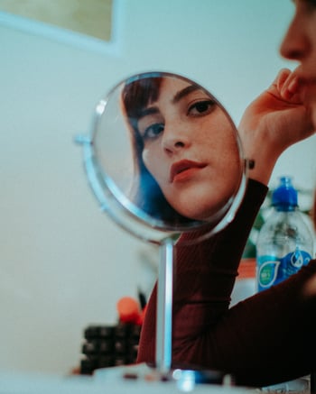 woman reflection in mirror